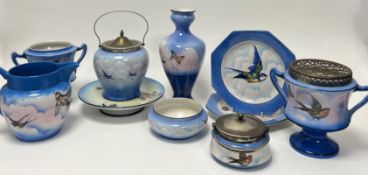 A large quantity of Palissy tableware, each piece decorated with butterflies and various flying