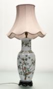 A Chinese famillie verte baluster shaped table lamp, with hand-painted blossoming floral tree still,