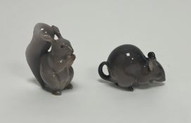 A Royal Copenhagen figure of a squirrel eating a nut, No. 982 (h. 7cm), together with a Royal