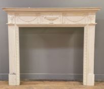 A modern Adam-style pine and gesso fire surround, moulded cornice over central urn and floral swag