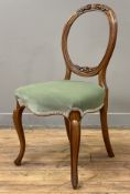A Victorian walnut side chair, carved balloon back over light green upholstered seat, raised on