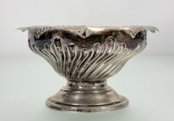 A Victorian London silver nut dish of tapered spiral form with gadroon border on circular stepped