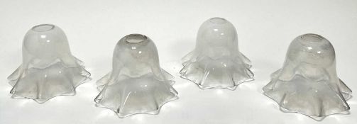 A set of four Art Nouveau-style hand-blown art glass lamp shades with a pearlescent finish,