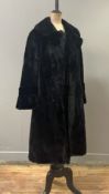 A ladies mink fur coat by Karter (Scotland), three-quarter length, double-breasted with two rows