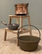 Three early 20th century cooking pots, one copper and one brass each with handles: H. 30cm