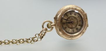 A late 19thc French 14ct gold outer cased fob watch with gilt dial and roman numerals: d. x 2cm