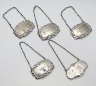 A set of four London silver decanter labels in the George III style to include Gin, Whisky, Sherry