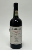 A bottle of Grahams Malvedos 1965 Vintage Port, bottled in 1967, Oporto, Portugal, 20.7% vol,