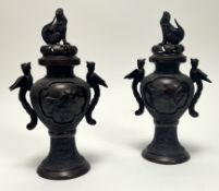 A pair of 20th Japanese bronze incense burners, the body centered each side with low relief birds