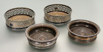 A pair of late Victorian Sheffield plated wine slides with gadroon borders and copper ringed