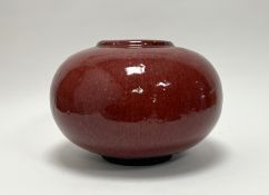 A Chinese vase of compressed bulbous form, with oxblood red glaze to exterior, and turquoise-green