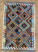 A hand-knotted Chobi kilim rug, central panel with repeating geometric and diamond motifs, ivory