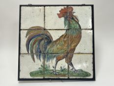 A decorative ceramic tile mural decorated with a hand-painted rooster complete with a crackle