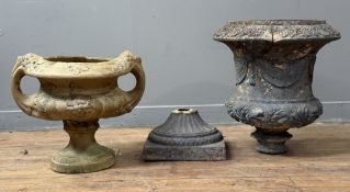 A ceramic twin-handled garden urn moulded with grapes and vine leaves; together with a larger