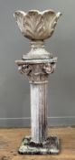 A painted leaf-cast composition stone planter (part of base lacking), on an associated painted