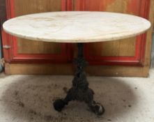 A cast-iron and marble garden table, the associated circular white marble top (unsecured) on a