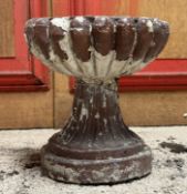 A small stoneware or terracotta reeded planter, the bowl on a tapering stand and circular base. 31cm