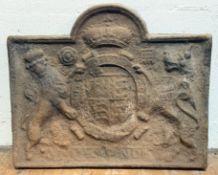 An 18th century cast-iron fireback, of rectangular form with arched crest, cast with a coat of