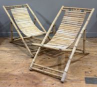 A pair of bamboo-framed deckchairs, 20th century. Each c. 83cm by 104cm by 60cm.
