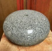 A granite curling stone (lacking handle). Diameter 28cm.