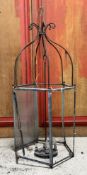 A large weathered cast-metal hexagonal lantern, with arched scrolling surmount (a/f). Height 133cm.