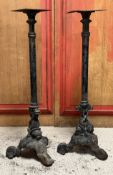 A pair of painted cast-iron tall stands, (en suite with the base for lot 53), of columnar form, cast