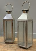 A pair of modern white metal garden lanterns, glazed with loop handles. Height including handles