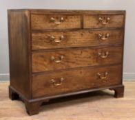 A George III mahogany chest of drawers, fitted with two short over three graduated long drawers,