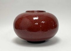 A Chinese vase of compressed bulbous form, with oxblood red glaze to exterior, and turquoise-green