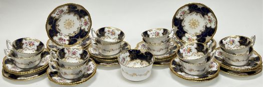 An early 20thc Coalport tea service, with blue batwing decoration and gilt detailing, comprising