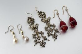 A pair of 9ct gold graduated pearl drop earrings: l. x 3cm largest pearl 0.7cm 2.1g together with