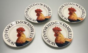 A collection of four Emma Bridgewater Hen & Toast breakfast plates, decorated with a hen and '