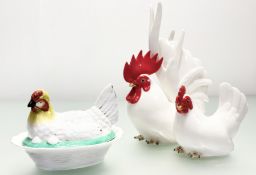 A Noritake Rooster (h-27.5cm) and Hen (h-12.5cm) figurines together with a nesting hen ceramic dish,
