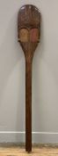 A hardwood tribal-style paddle, with painted and carved decoration to top: L. 120cm