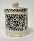 An Emma Bridgewater Black Toast & Marmalade 'Ms Chere Amie' candle with cover, decorated with