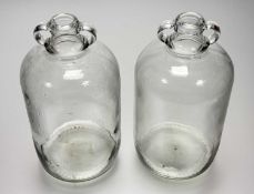 A pair of clear glass demijohn gallon jars. (h-31.5cm) (2)
