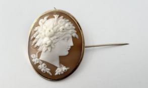 A yellow metal mounted shell carved portrait brooch / pendant after the antique: h. x 4.5cm w. x 4cm
