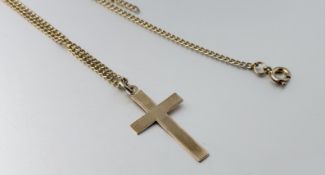 A 9ct gold cross pendant on a gilt metal chain necklace with ring fastening: cross l. x 3cm 1.2g