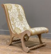 An Edwardian child's slipper chair, scrolling beech frame with cream damask fabric (a/f): H. 61cm W.