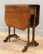 An Edwardian mahogany Sutherland table, rectangular top with drop leaves, raised on turned