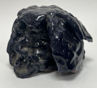 An abstract studio pottery centerpiece of naturalistic form, decorated with vibrant deep blue glaze,