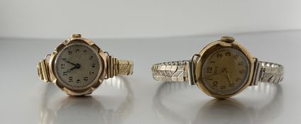 A vintage Uno 9ct gold manual wind wristwatch with champagne dail and arabic on gilt metal expanding