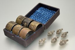 A late 19thc Japanese Western market set of six bronze napkin rings, each with a phoenix and