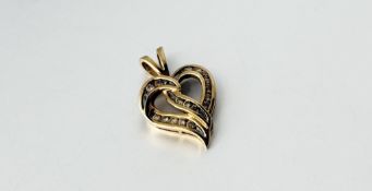 A 9ct gold scrolling heart shaped peendant set 0.25ct of diamond points: l. x 2.2cm 1.98g