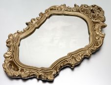 A modern rococo-style gilt painted resin carved frame with mirror panel to center. (68cmx39.5cm)