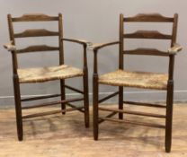 A pair of Arts and Crafts carver chairs, in the style of Morris & Co, ash frame with ladder-back and