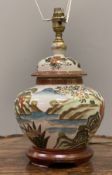 A Japanese Satsuma ginger jar table lamp, decorated with landscape scenes and floral motifs, on a