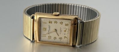 A London 9ct gold cased tank style manual wind wirstwatch by Thomas Russell & Son with champagne