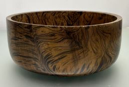 A large modern exotic hardwood centerpiece bowl, probably mango wood, complete with smooth finish of