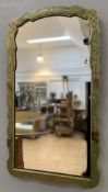 A 1920s Chinoiserie wall mirror, shaped plate enclosed within a green frame featuring figures in a